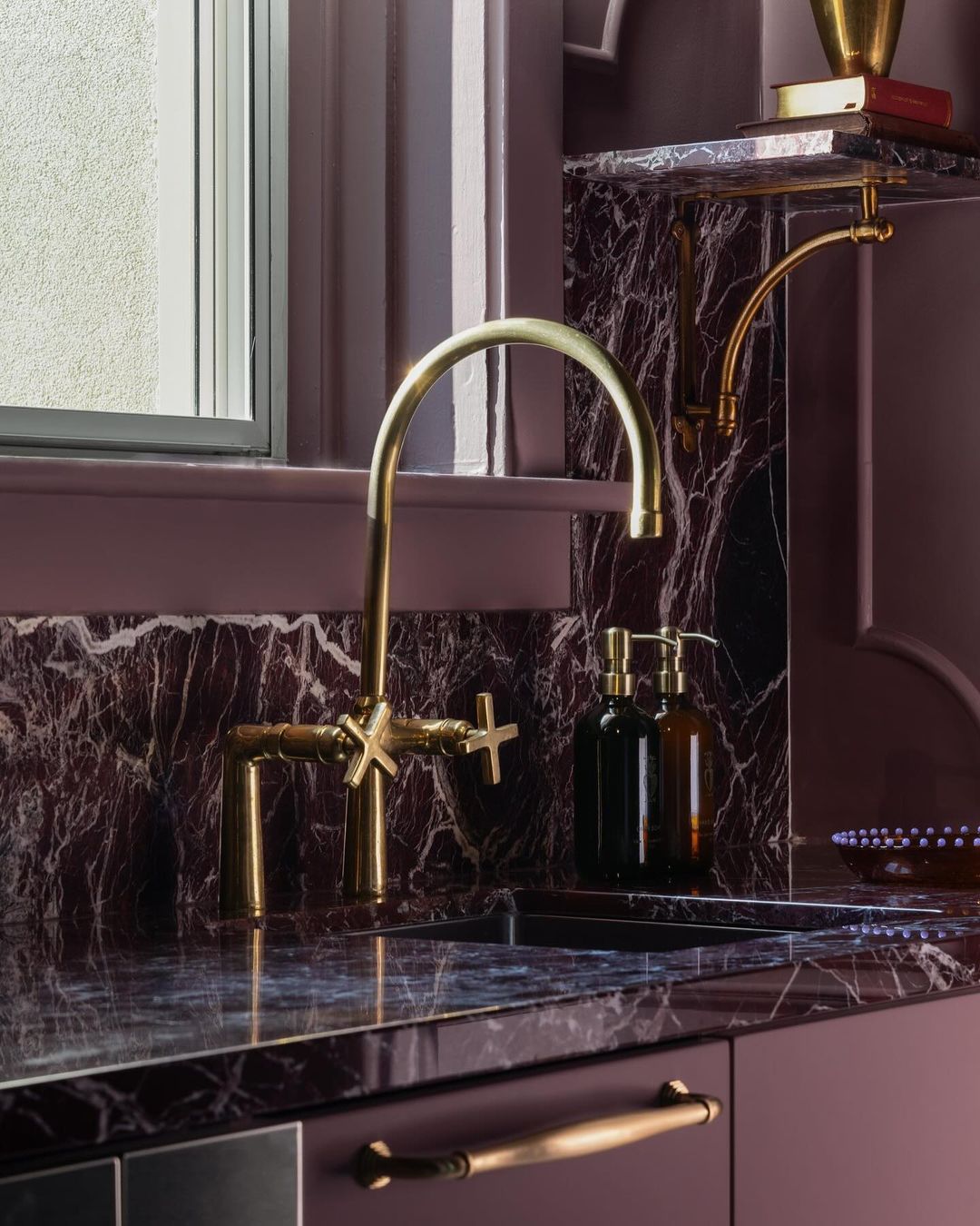 Unlacquered brass kitchen faucet showing natural patina development – Brass For Homes Marrakech