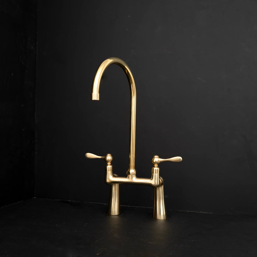 Unlacquered brass bridge kitchen faucet – two-handle design, front view