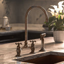 Unlacquered brass Victorian bridge faucet – installed in traditional kitchen