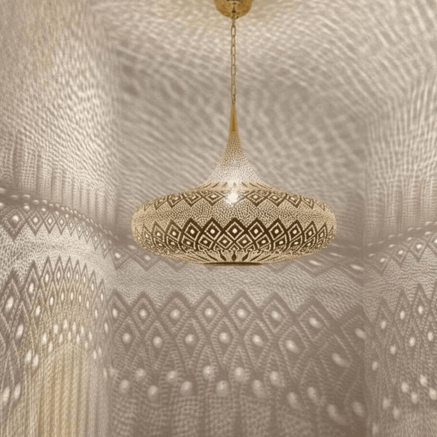 Brass wide dome pendant light boho style hanging over living room – Brass For Homes