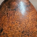 Hammered copper kitchen island pendant showing warm amber downlighting — Brass For Homes