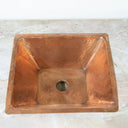 Handcrafted hammered copper sink – close-up of texture and rim