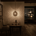 Brass globe shadow lamp hanging over dining table in Moroccan decor – Brass For Homes