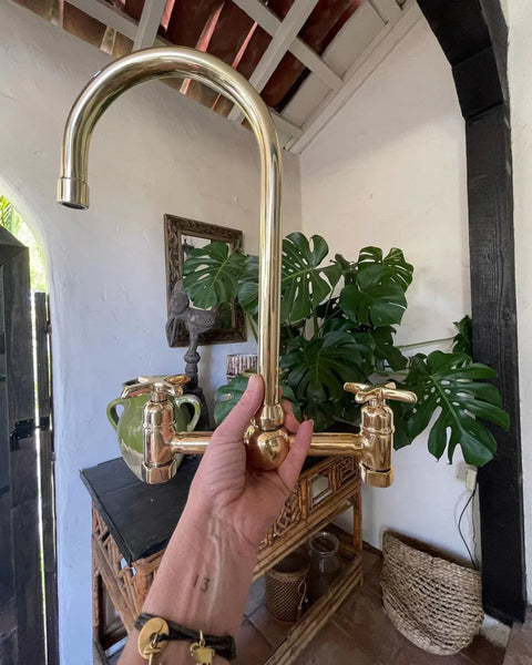 Unlacquered brass bridge kitchen faucet with lever handles – front view