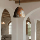 Rustic oxidized copper pendant hanging in warm-toned kitchen – Brass For Homes