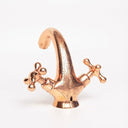 Hand-engraved copper faucet – installed on bathroom vanity with basin