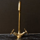 Unlacquered brass gooseneck faucet – natural patina finish detail