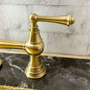 Unlacquered brass 3-leg deck mount faucet – installed in kitchen
