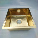 Hammered unlacquered brass kitchen sink – installed in countertop