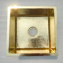 Hammered unlacquered brass kitchen sink – close-up of textured surface