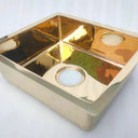 Unlacquered brass single bowl kitchen sink – clean undermount profile, front view